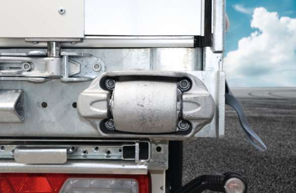 The trailer body is protected and the impact force is directed into the chassis.