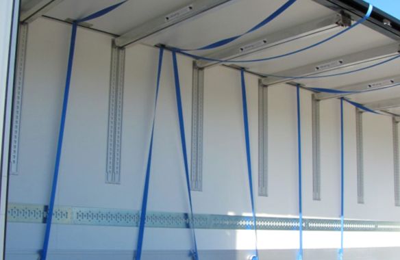 Holders for load securing belts
